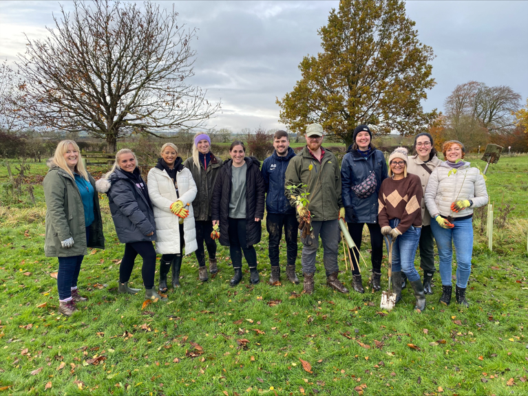 The NEPO team at Stamfordham Sports Pavilion planting trees.