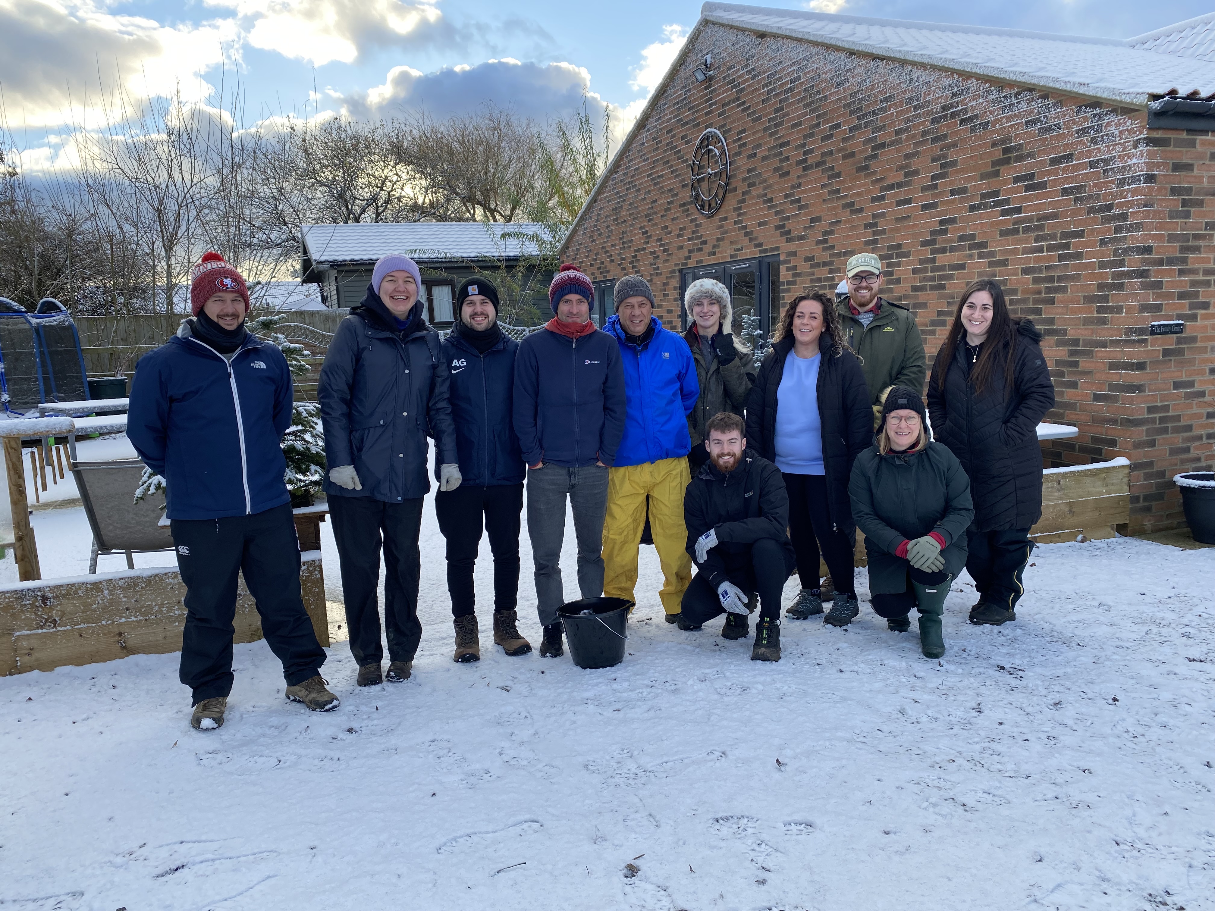 A group of NEPO staff on a volunteer day at PACT NE